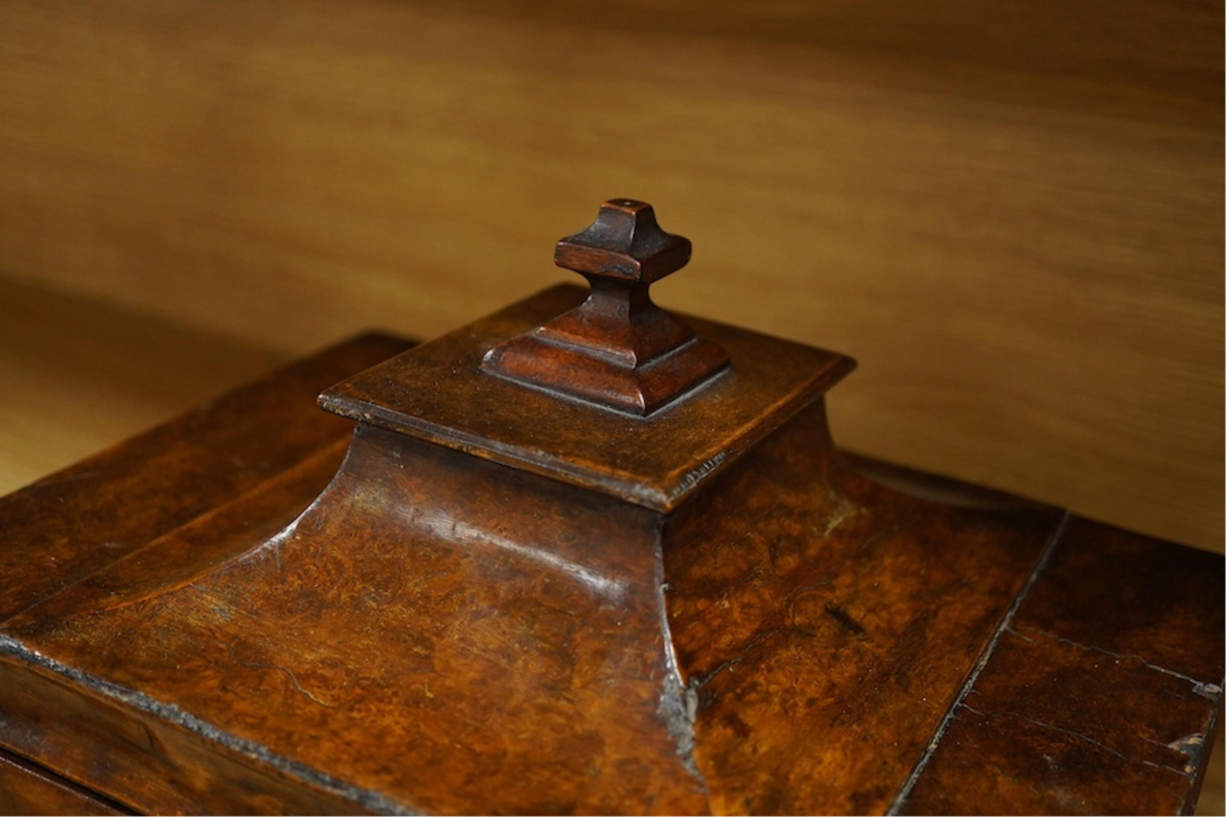 A Victorian burr walnut pagoda’ shaped sewing box incorporating a folding writing slope, 28cm wide. Condition - poor to fair